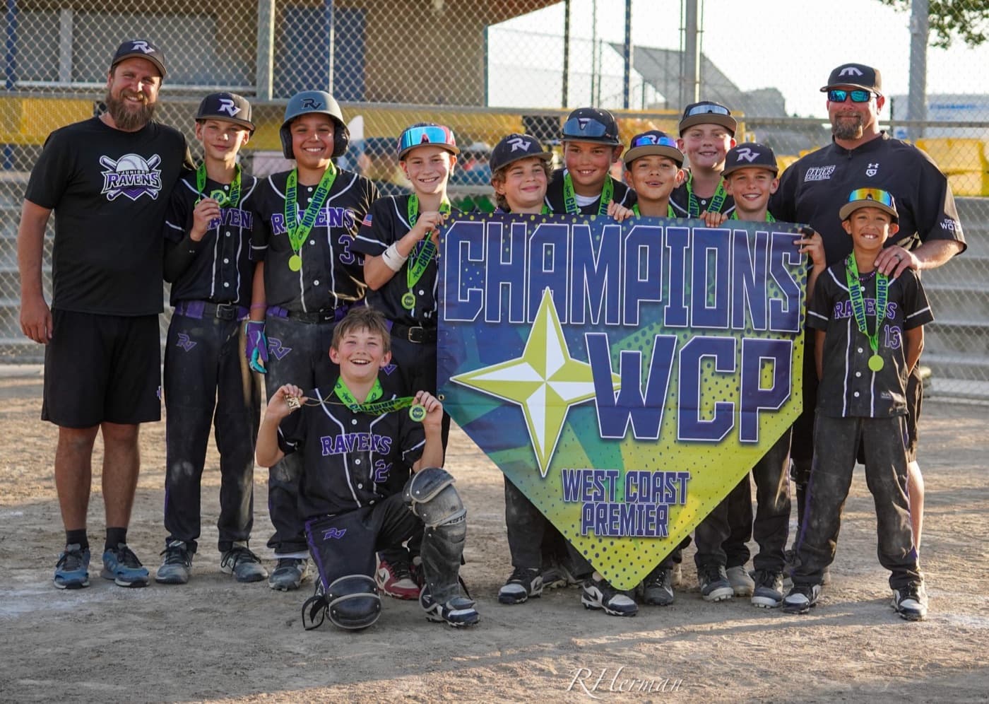 A Ravens team with their tournament champions sign